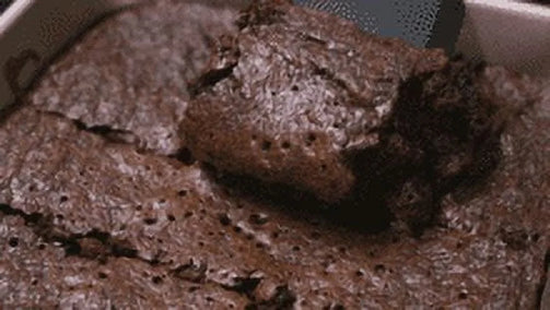 Keto Friendly Brownie being scooped out of a tray.